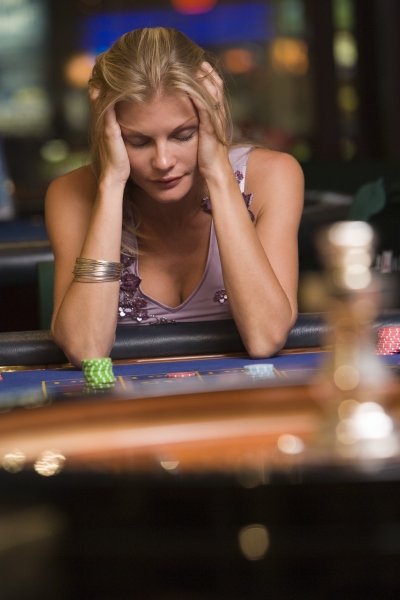 2124369-woman-losing-at-roulette-table